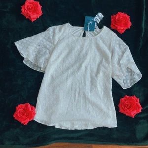 I absolutely love this blouse. The white is so crisp. Too cute!!